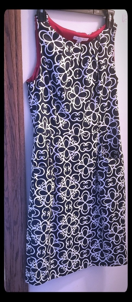 Black, white, and red casual business dress.